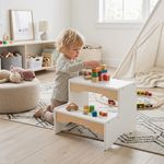 Child playing with wooden 2-step toddler stool in bedroom, reaching countertop