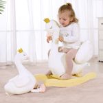 Toddler riding white swan plush rocker with matching swan toy