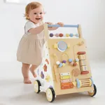 Toddler standing and learning to walk with wooden activity push walker