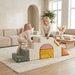 Children playing on soft foam climbing blocks in living room
