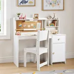White wooden kids study desk set with paper roll holder and cork bulletin board in playroom
