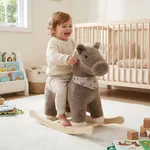 Toddler riding a labebe brown pony rocking horse in a nursery