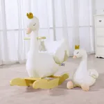 White swan plush rocking chair and small plush swan in cozy nursery room