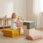 Toddler using soft foam blocks as activity table and seat