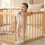 Baby playing safely in labebe natural wooden playpen with spacious indoor activity area