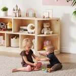 Children playing near solid rubber wood modular corner storage shelving unit