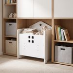 White toddler table and chair set used as compact toy and clothing storage