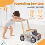 Toddler pushing wooden tool bench walker for early walking practice