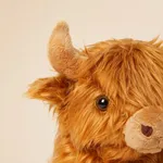 Close-up shot of soft plush fur, eyes, and horn details on Labebe highland cow rocker