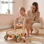 Parent helping toddler take first steps using Baby Einstein wooden activity walker