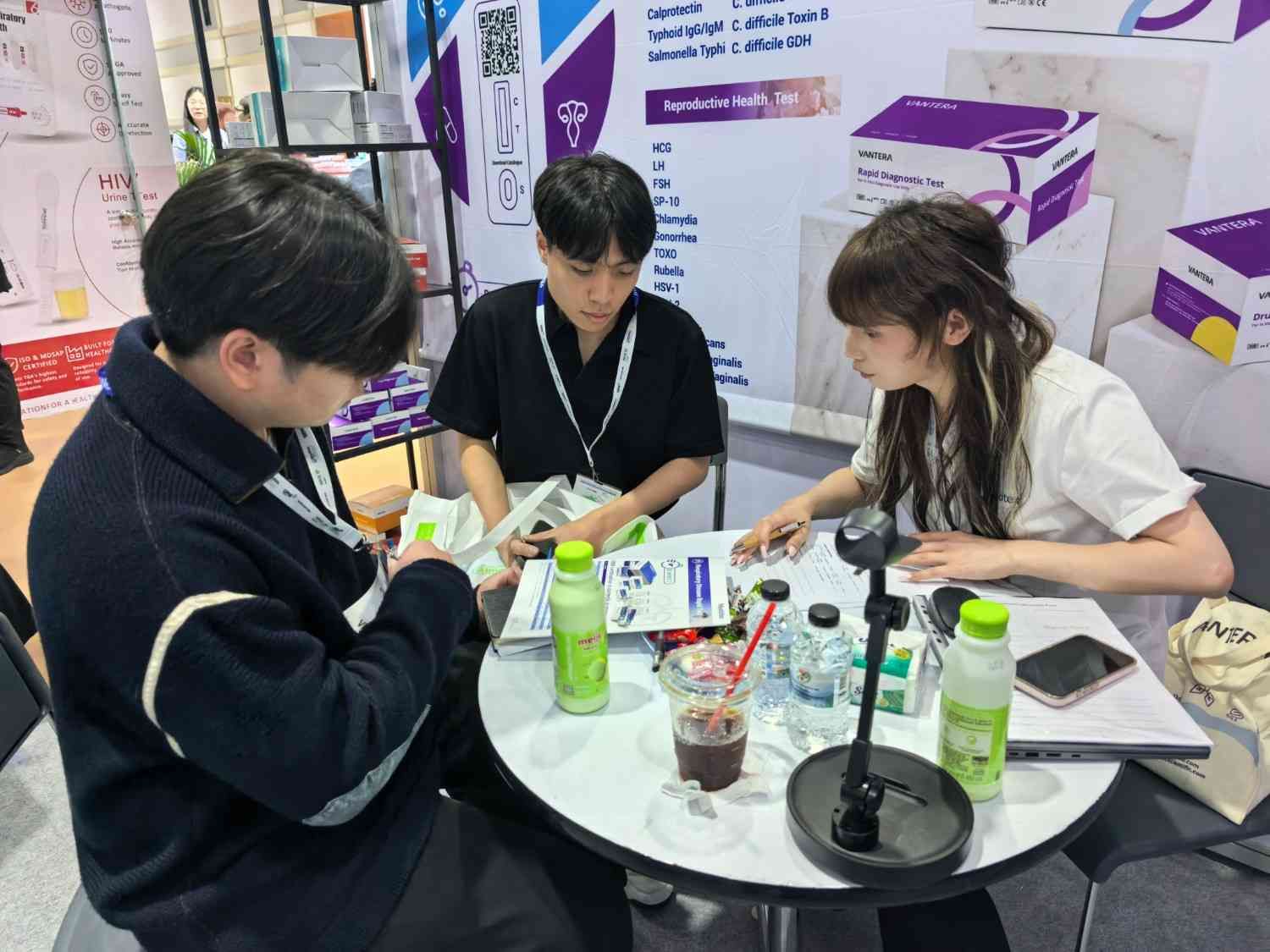 Business discussion with international visitors at Medotex booth