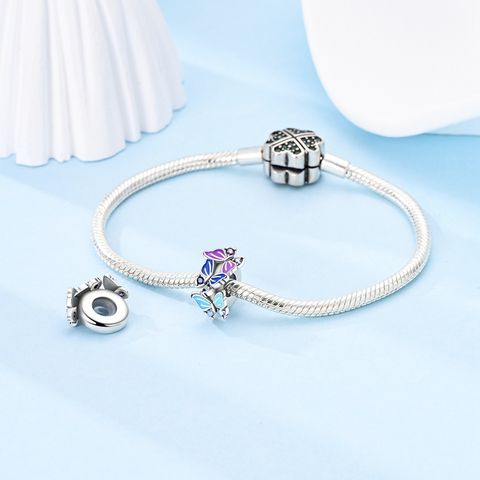 Clip de fixation papillon bleu glacier et violet