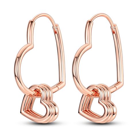 Herzförmige Ohrringe mit mehreren Ringen aus Roségold