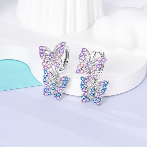 Boucles d&#39;oreilles papillon scintillantes