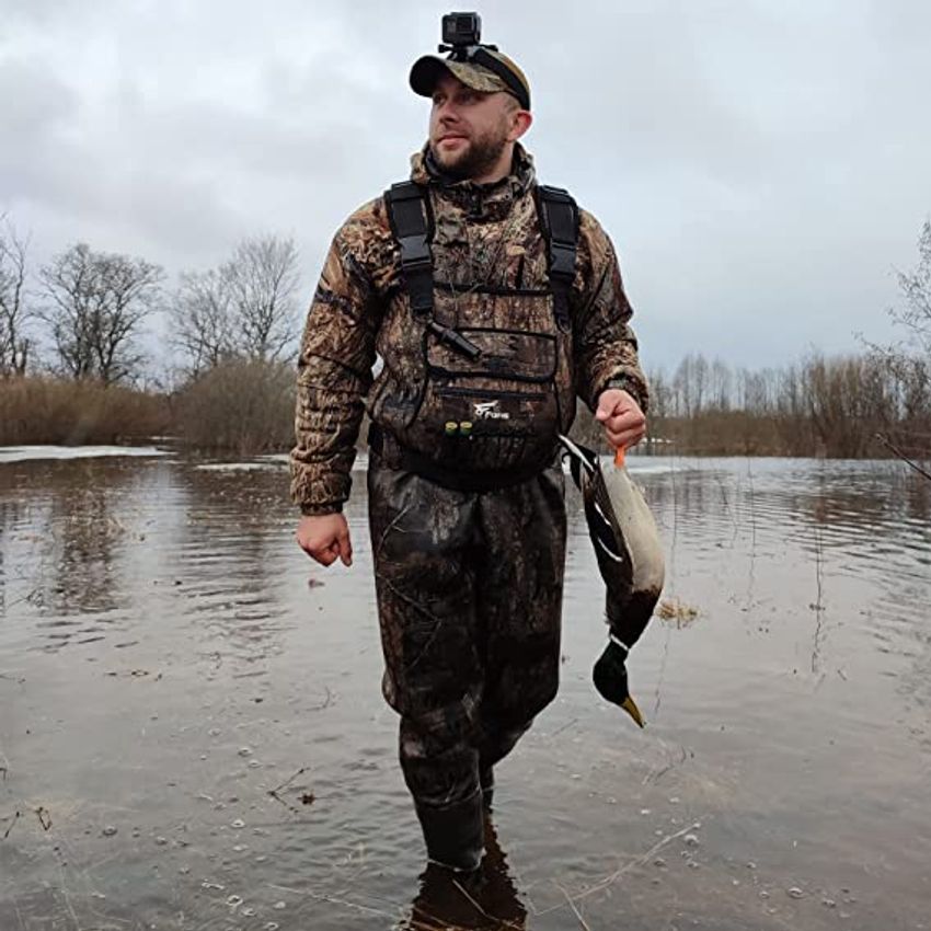 Man Fishing In Lake Wearing Chest Waders High-Res Stock Photo