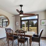 KBS High-Speed Wood and Black Ceiling Fan with Lights and Remote Control in a living room