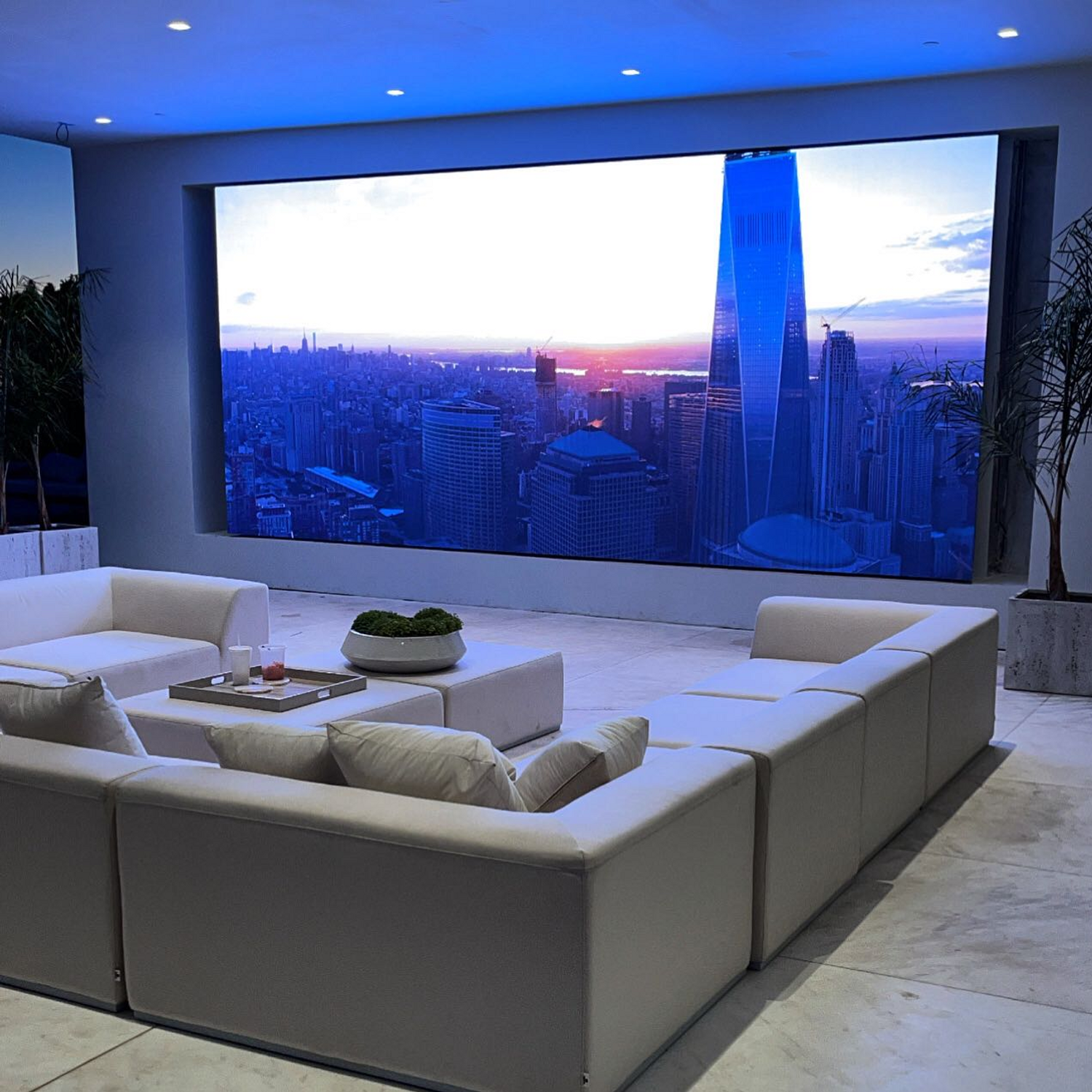 Luxurious indoor setting featuring a wall-sized 4K P125 LED display
