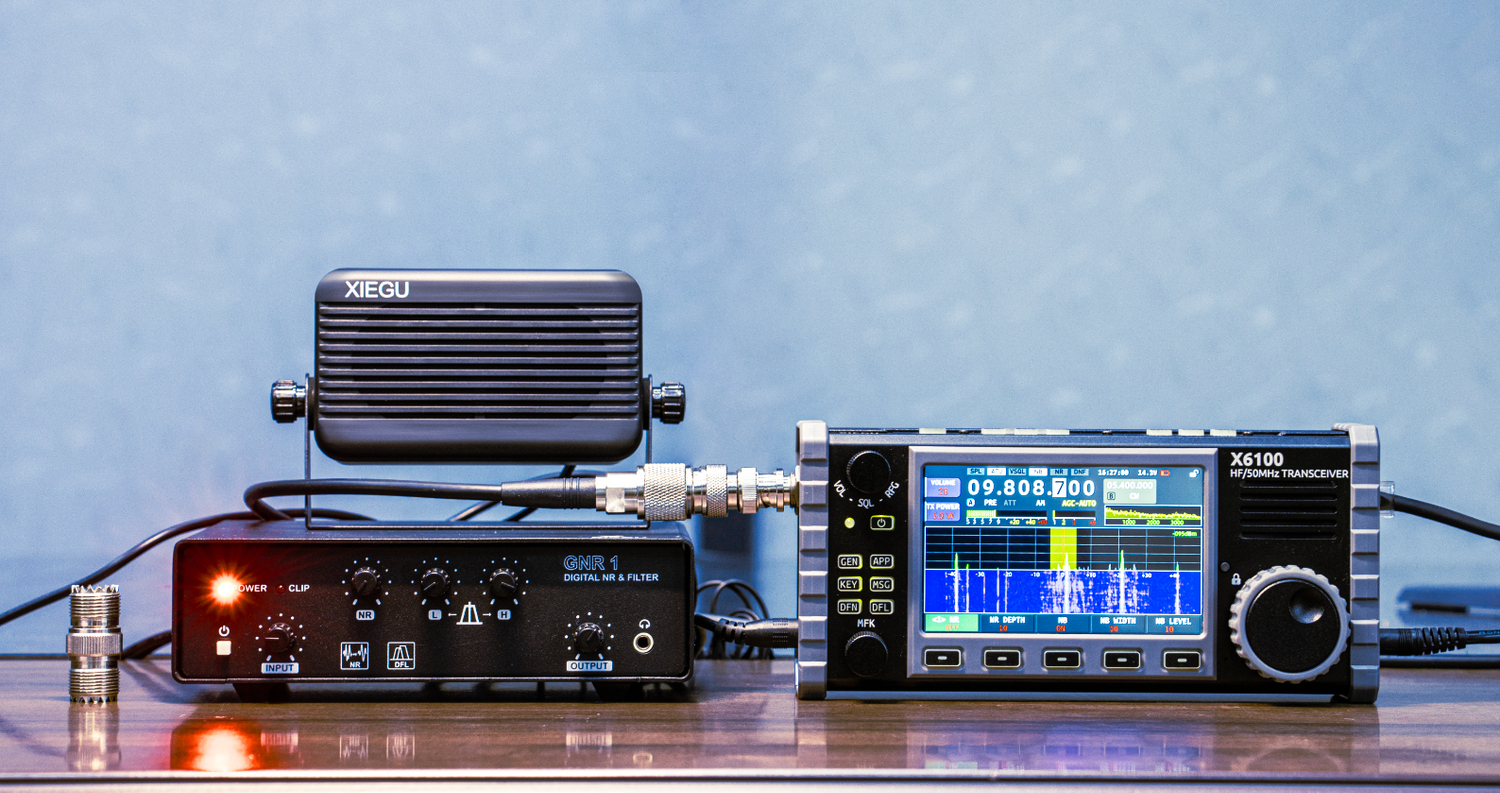 The XIEGU X6100 transceiver connected to an external amplifier and speaker