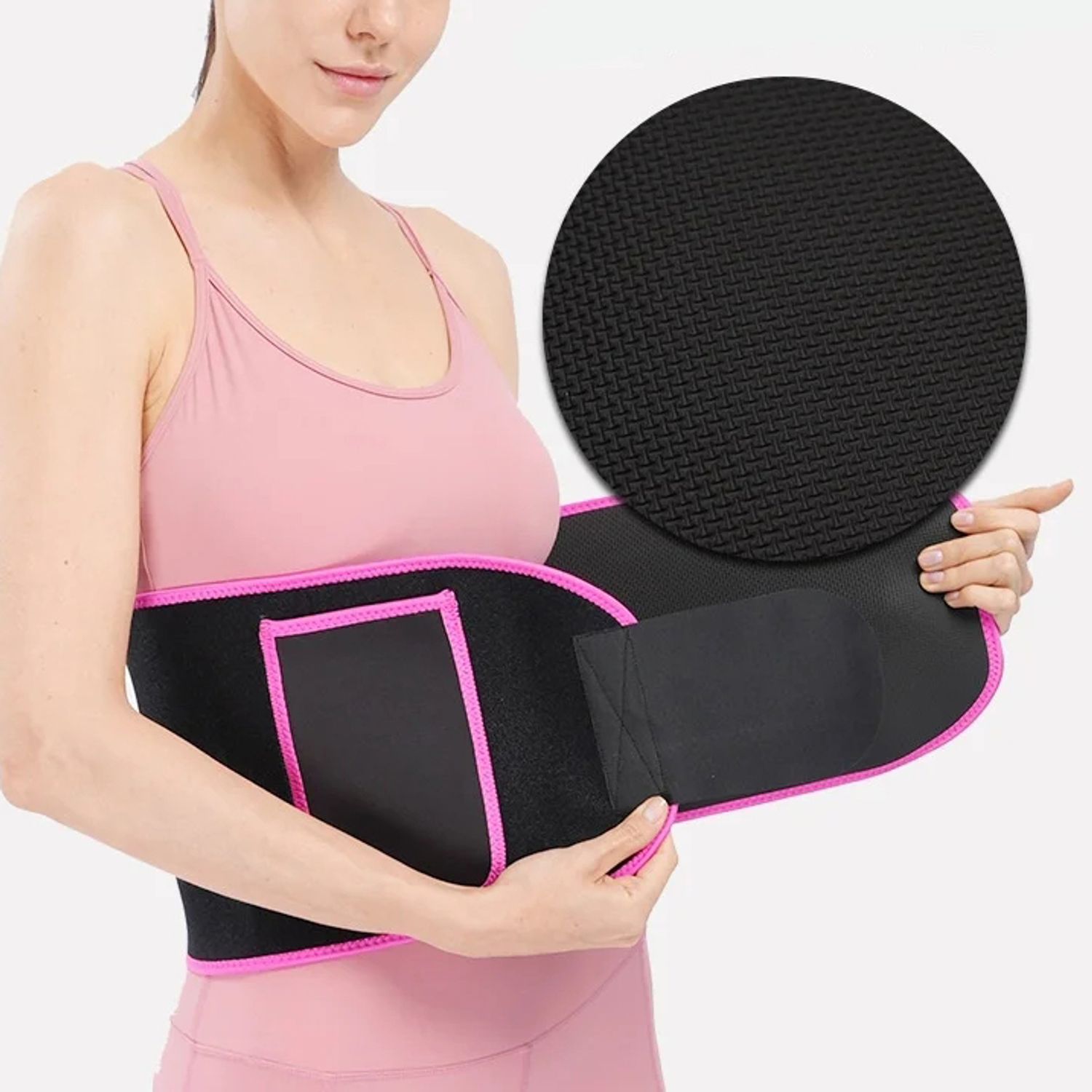 Woman wearing a pink neoprene waist trainer equipped with a convenient phone pocket during exercise