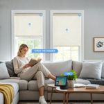 Persilux motorized linen roller shades in a modern living room with remote control